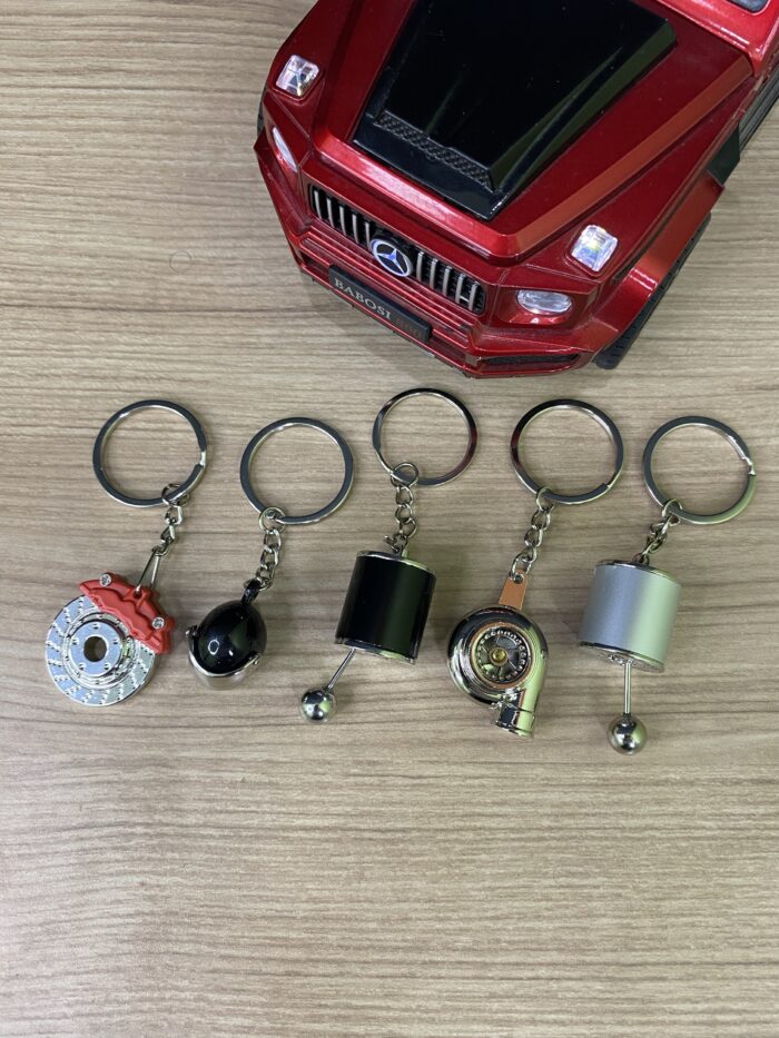 4 Keychain Combo | Gear Shifter | Disc Brake |  Turbo | Spinning Alloy Rims | Piston | Metal Shocker - Image 9