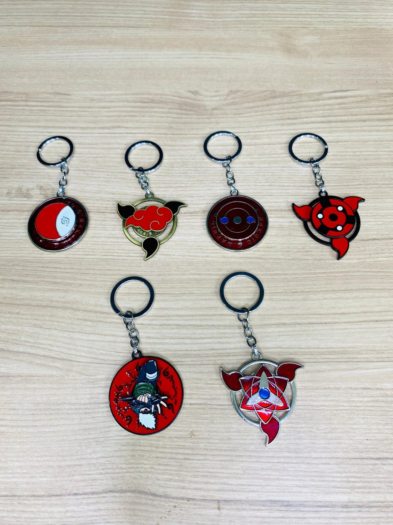 6-in-1 Naruto Spinning Keychain Set | Sharingan, Akatsuki & Ninja Symbols - Image 1